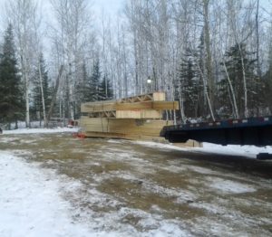 Roof truss deliver for custom lake home huisman concepts ely mn