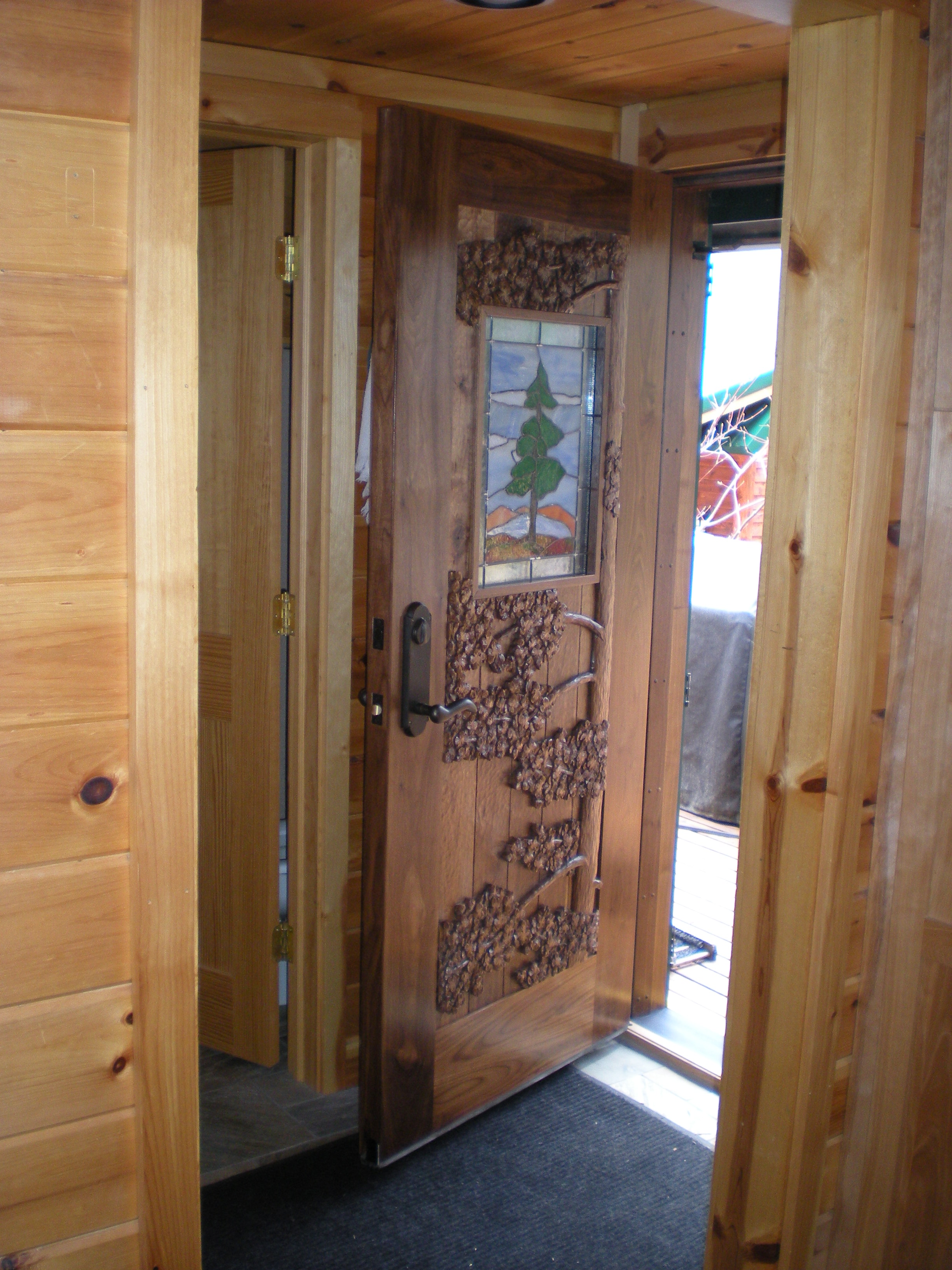 Carved Walnut door with stained glass