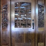 Intricately carved Walnut Entry Door with side lites
