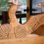 Carved loon on a cedar entry door