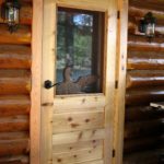 Carved loon through screen door